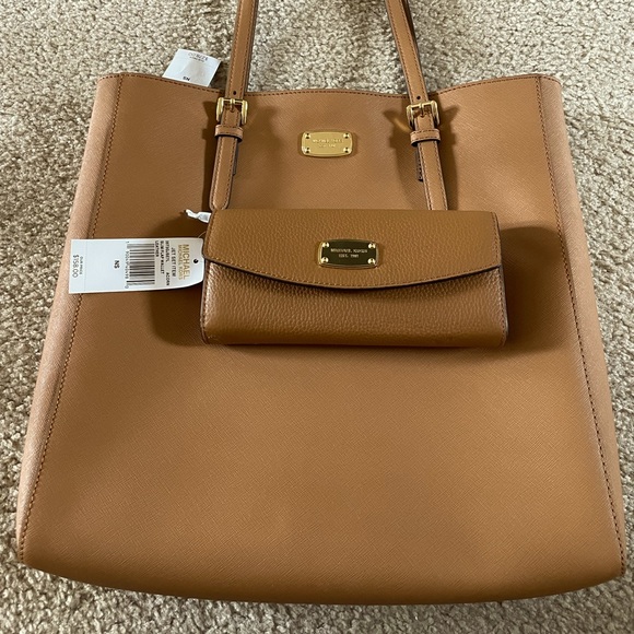Brand new with tags Michael Kors purse and wallet.